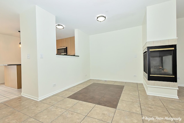 131 W Big Horn Dr Unit 131, Hainesville, IL 60030 - unfurnished living room featuring light tile patterned flooring, a fireplace, and baseboards