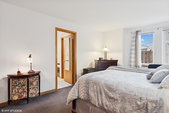 carpeted bedroom featuring baseboards