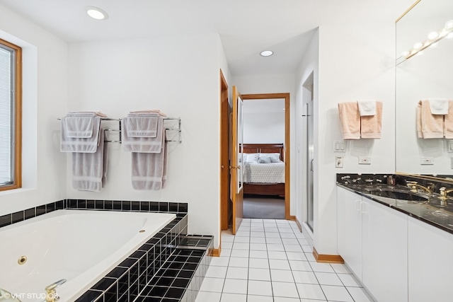 full bath featuring a jetted tub, tile patterned flooring, vanity, ensuite bathroom, and recessed lighting