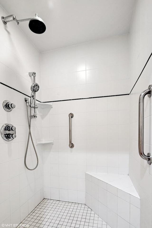 bathroom with a tile shower