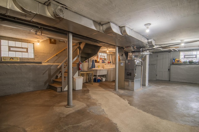 below grade area with stairs and heating unit