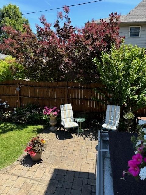 view of patio featuring fence