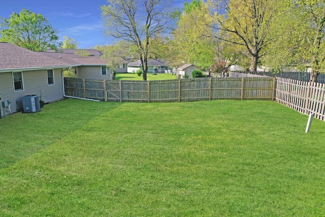 414 Ridgecrest Dr, Washington, IL 61571 - view of yard featuring central AC and a fenced backyard