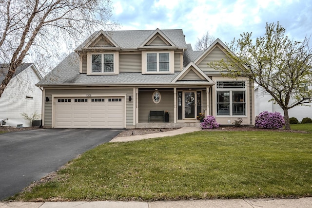 view of front of property featuring central AC, a front lawn, aphalt driveway, covered porch, and roof with shingles
