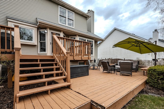 wooden terrace with fence and outdoor dining area