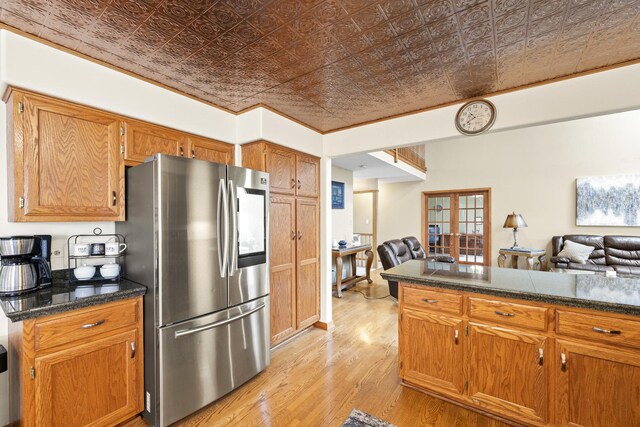 kitchen featuring an ornate ceiling, light wood-style flooring, open floor plan, and smart refrigerator