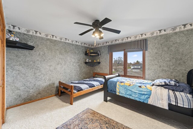 bedroom with ceiling fan and carpet