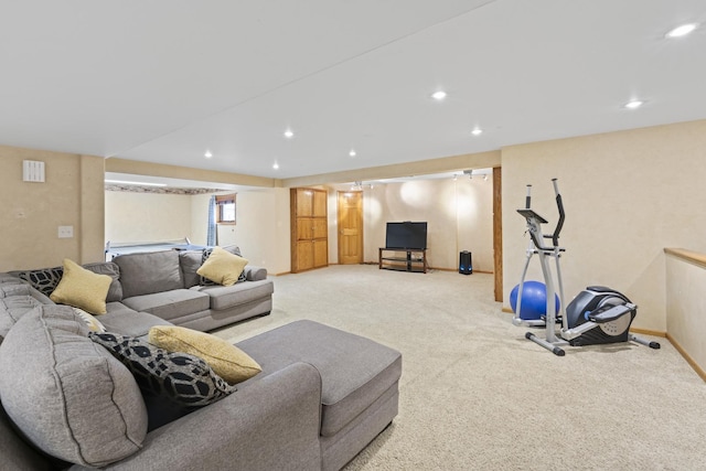 living area featuring baseboards, carpet floors, and recessed lighting