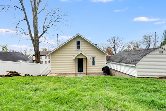 2021 1st St, Peru, IL 61354 - back of property with fence, a yard, a shingled roof, and a wooden deck