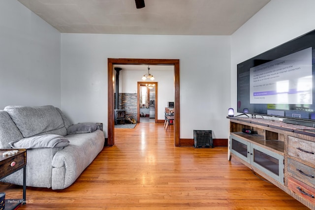 2021 1st St, Peru, IL 61354 - living room with a wood stove and light wood-style flooring