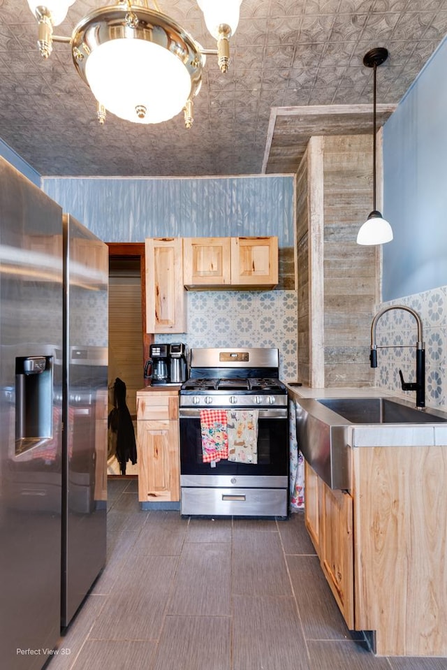 2021 1st St, Peru, IL 61354 - kitchen featuring a sink, stainless steel appliances, an ornate ceiling, light brown cabinetry, and decorative light fixtures