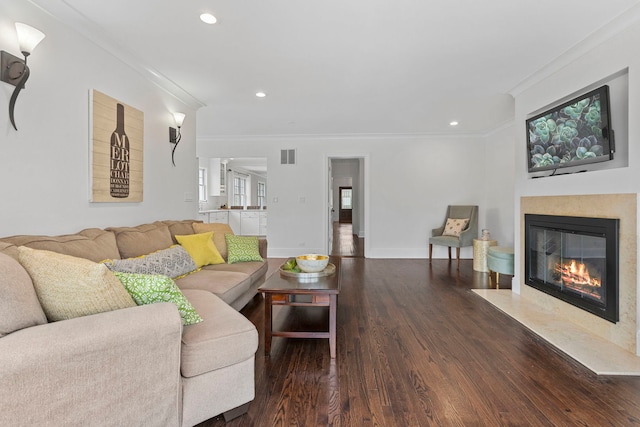 91 Wagner Rd, Northfield, IL 60093 - living room with a fireplace with flush hearth, recessed lighting, wood finished floors, visible vents, and ornamental molding