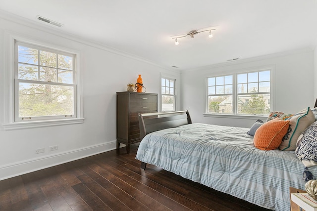 91 Wagner Rd, Northfield, IL 60093 - bedroom featuring baseboards, ornamental molding, dark wood-type flooring, and visible vents