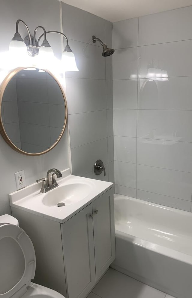 bathroom with vanity, toilet, and shower / tub combination