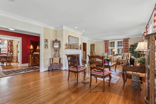 915 W Clark St, Champaign, IL 61821 - living room featuring wood finished floors, crown molding, a fireplace, baseboards, and recessed lighting