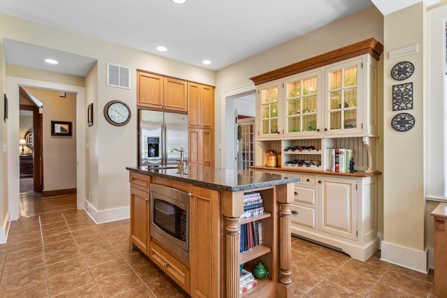 915 W Clark St, Champaign, IL 61821 - kitchen with appliances with stainless steel finishes, open shelves, baseboards, tile patterned floors, and recessed lighting