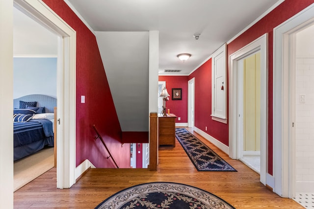915 W Clark St, Champaign, IL 61821 - corridor with an upstairs landing, wood finished floors, ornamental molding, and baseboards
