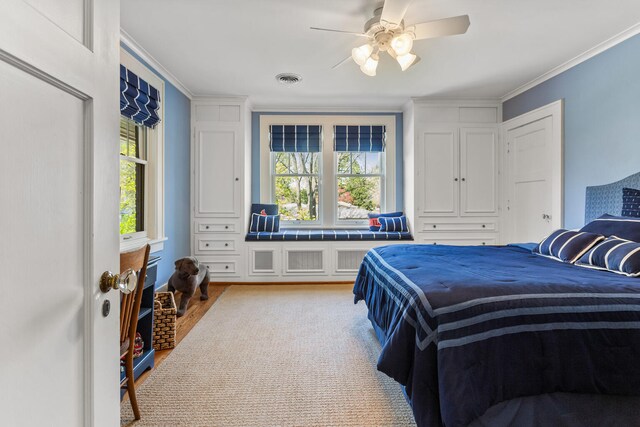 915 W Clark St, Champaign, IL 61821 - bedroom with wood finished floors, crown molding, and a ceiling fan