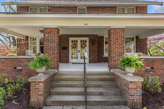 915 W Clark St, Champaign, IL 61821 - property entrance featuring a porch and brick siding