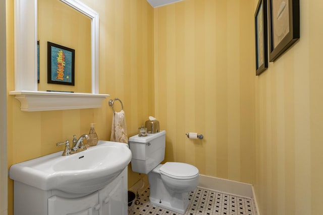 915 W Clark St, Champaign, IL 61821 - half bath with toilet, wallpapered walls, baseboards, and a sink