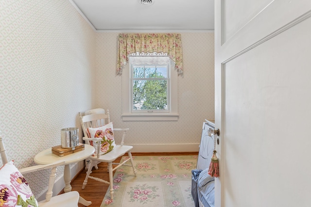 915 W Clark St, Champaign, IL 61821 - living area with wood finished floors, wallpapered walls, and baseboards