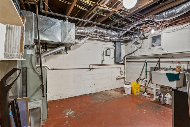 915 W Clark St, Champaign, IL 61821 - unfinished basement with a sink and electric panel