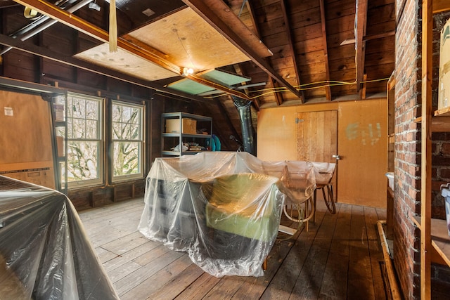 915 W Clark St, Champaign, IL 61821 - miscellaneous room featuring hardwood / wood-style floors and wooden walls