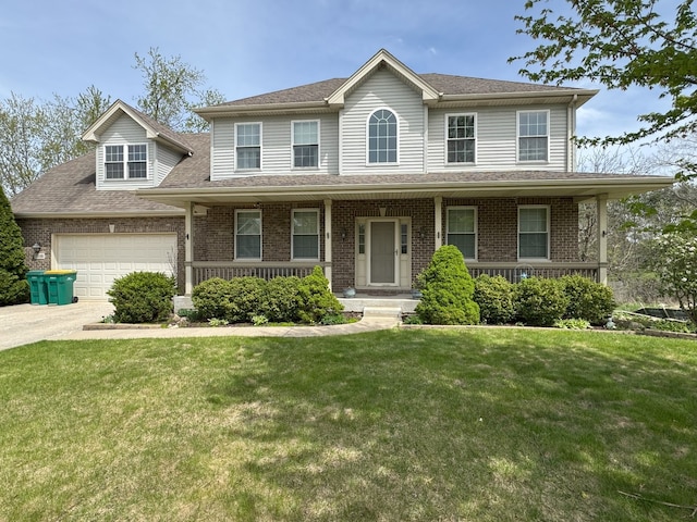 colonial house with brick siding, a front lawn, an attached garage, and a porch