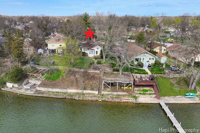 birds eye view of property featuring a residential view and a water view