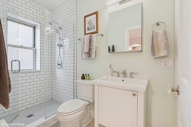6133 N Hoyne Ave Unit 1, Chicago, IL 60659 - bathroom with a shower stall, toilet, and vanity