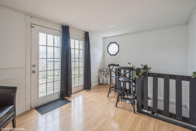 241 Tiverton Ln, Steger, IL 60475 - doorway featuring wainscoting, wood finished floors, and a decorative wall