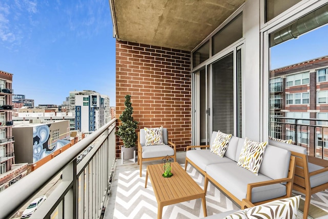 balcony with a view of city and an outdoor hangout area