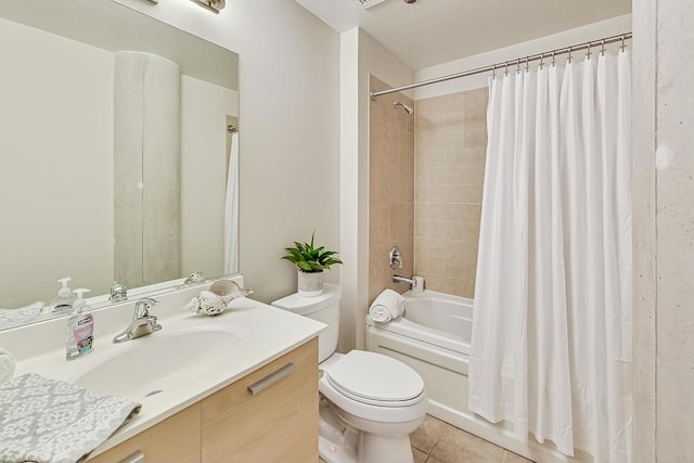full bathroom with tile patterned flooring, shower / tub combo, toilet, and vanity