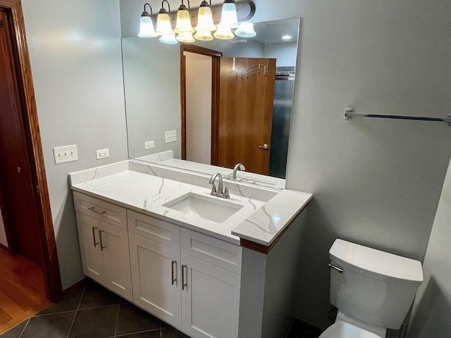 15753 Scotsglen Rd, Orland Park, IL 60462 - bathroom with a chandelier, toilet, vanity, and tile patterned floors