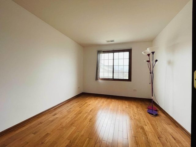 15753 Scotsglen Rd, Orland Park, IL 60462 - unfurnished room with light wood-type flooring, baseboards, and visible vents