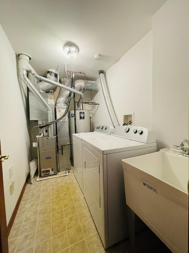 15753 Scotsglen Rd, Orland Park, IL 60462 - laundry room with washing machine and clothes dryer, baseboards, a sink, and laundry area