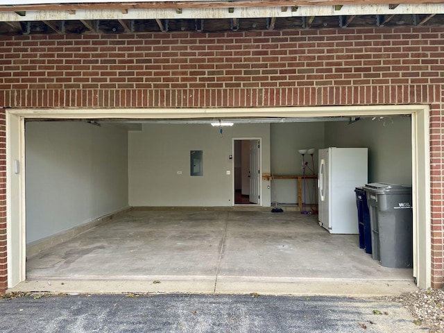 15753 Scotsglen Rd, Orland Park, IL 60462 - garage with electric panel and freestanding refrigerator