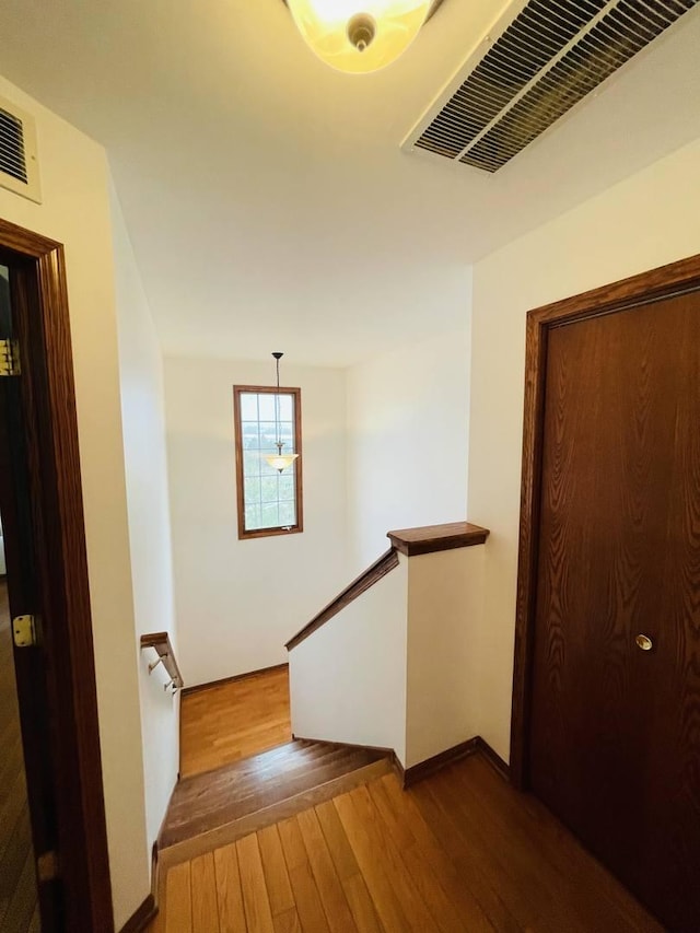 15753 Scotsglen Rd, Orland Park, IL 60462 - stairs with baseboards, hardwood / wood-style floors, and visible vents
