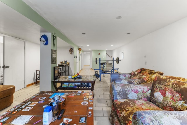 tiled living area featuring recessed lighting