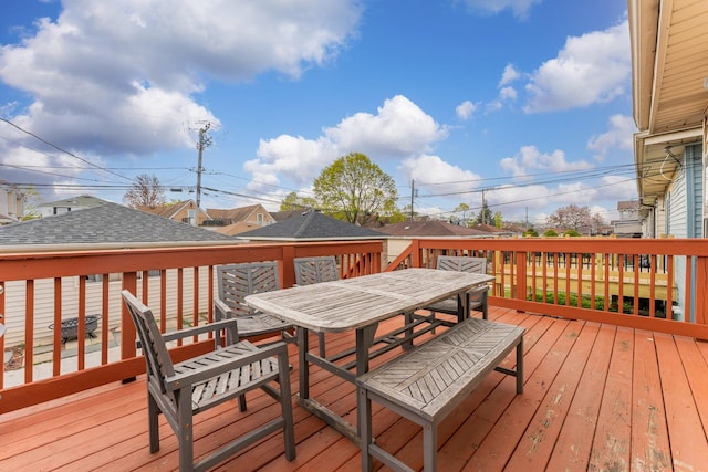 wooden deck featuring outdoor dining space