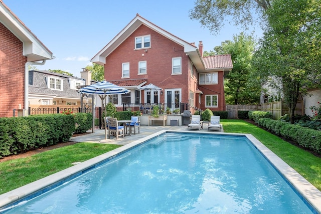 938 Edgemere Ct, Evanston, IL 60202 - rear view of property with a patio, a chimney, and brick siding