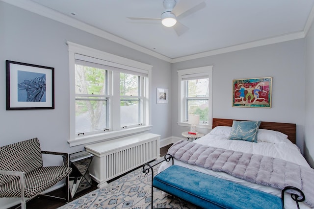 938 Edgemere Ct, Evanston, IL 60202 - bedroom featuring wood finished floors, radiator, multiple windows, crown molding, and baseboards