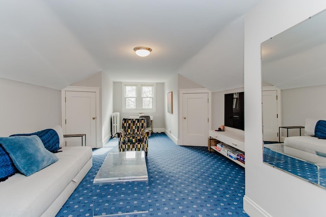 938 Edgemere Ct, Evanston, IL 60202 - carpeted living area featuring radiator heating unit, lofted ceiling, and baseboards