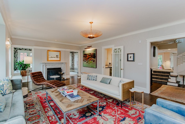 938 Edgemere Ct, Evanston, IL 60202 - living area featuring wood finished floors, healthy amount of natural light, crown molding, a fireplace, and stairway