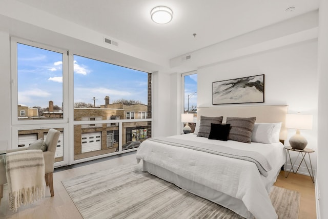 3204 N Kostner Ave Unit 401, Chicago, IL 60641 - bedroom with wood finished floors and visible vents
