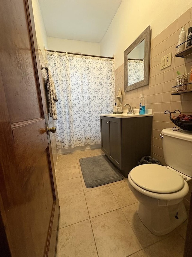 926 S Lathrop Ave, Forest Park, IL 60130 - bathroom featuring a shower with shower curtain, toilet, tile patterned flooring, and vanity