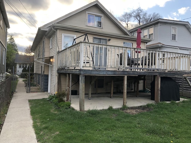 926 S Lathrop Ave, Forest Park, IL 60130 - back of property with fence, a wooden deck, and a yard