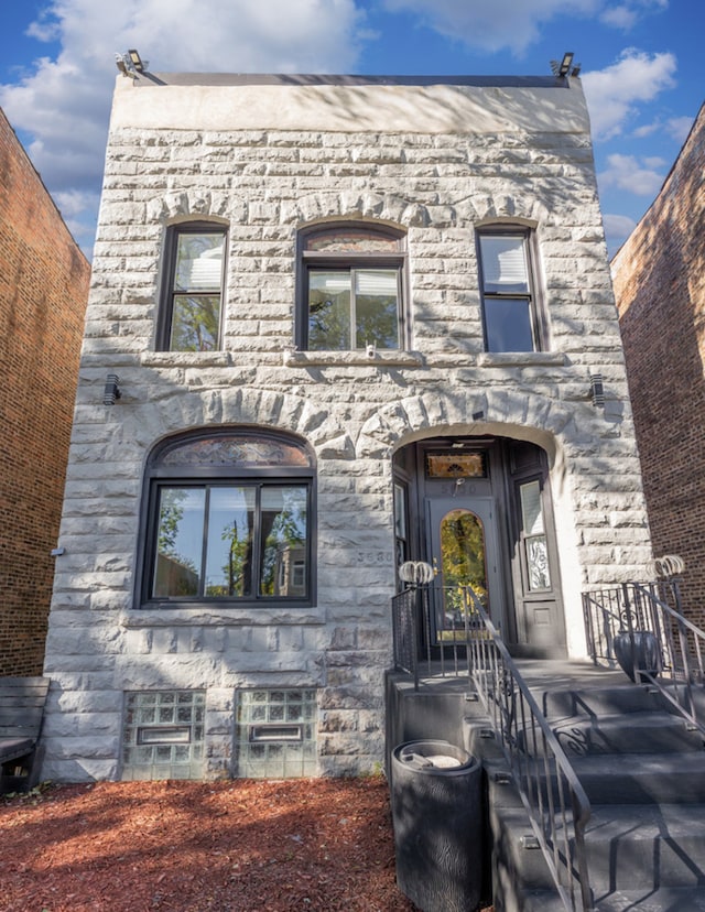 view of front of home featuring stone siding