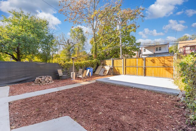 view of yard with a gate and fence