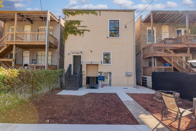 rear view of house featuring stairway